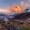 Snowy Himalayan peaks glow at sunrise near Annapurna Base Camp.