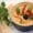 Hummus with herbs and olive served with pita bread