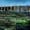 Modern hotel building in Iceland surrounded by moss-covered lava fields under a dramatic evening sky.