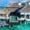 Overwater villa with private pool at a luxury resort in the Maldives surrounded by clear turquoise waters.