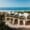 Modern beachfront hotel in Oaxaca with arched architecture and ocean views.