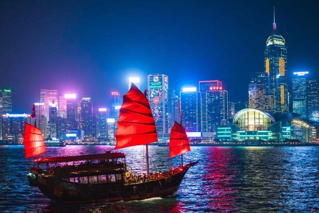 Discover the 11 Best Tourist Spots in Hong Kong Island 4 Traditional junk boat sailing across Victoria Harbour at night, Hong Kong Island