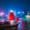 Traditional junk boat sailing across Victoria Harbour at night, Hong Kong Island
