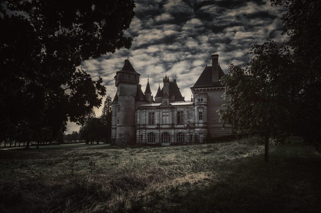 Top 10 Most Haunted Places on Earth You Should Know About 4 Eerie haunted castle under dark, stormy skies at night